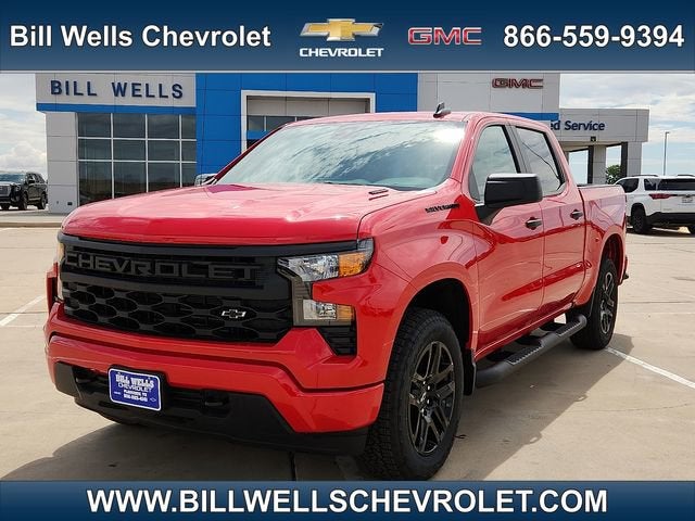 2026 Chevrolet Silverado 1500 Custom in Red Hot — front three-quarter view