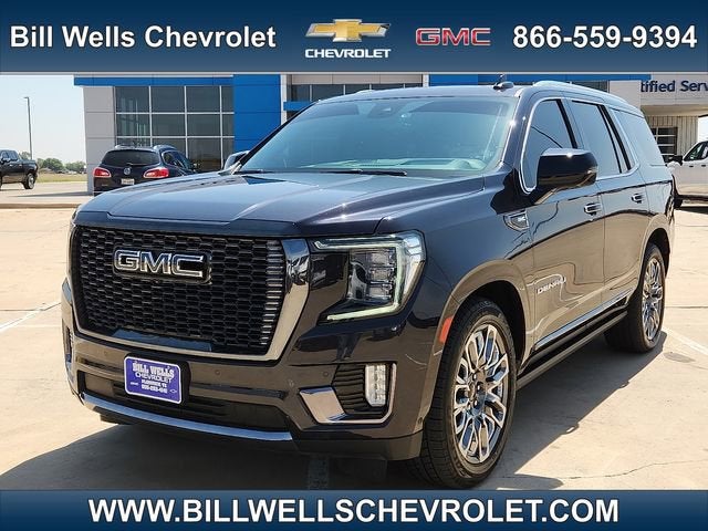 2024 GMC Yukon Denali Ultimate in Titanium Rush Metallic — front three-quarter view